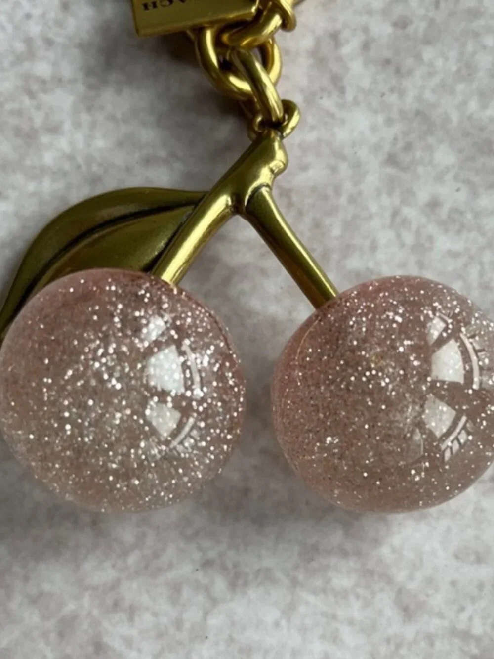 COACH Pink Glitter Cherry Bag Charm with Gold Hardware